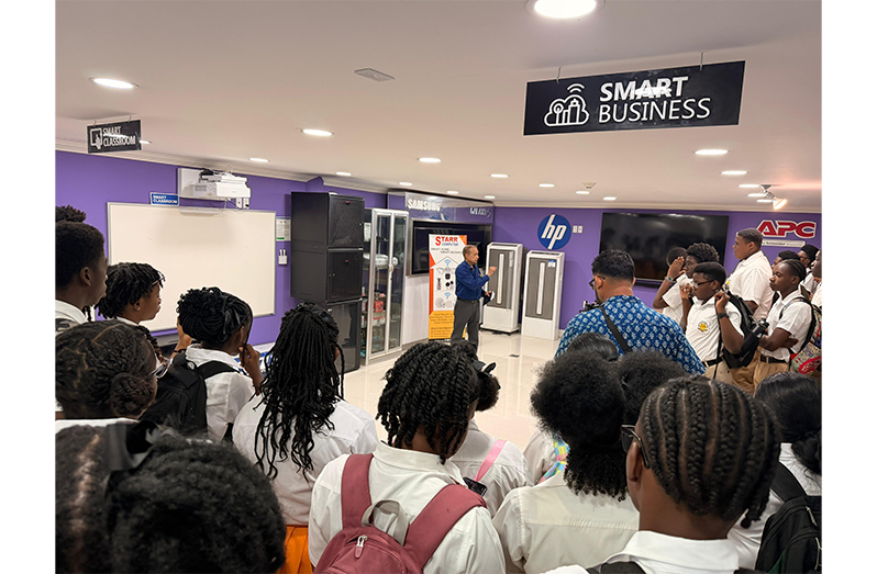 Students from Brickdam Secondary and Charlestown Secondary schools listen attentively to discussions and topics presented by Mr. Mohan during their visit to STARR Computer in Brickdam, Georgetown