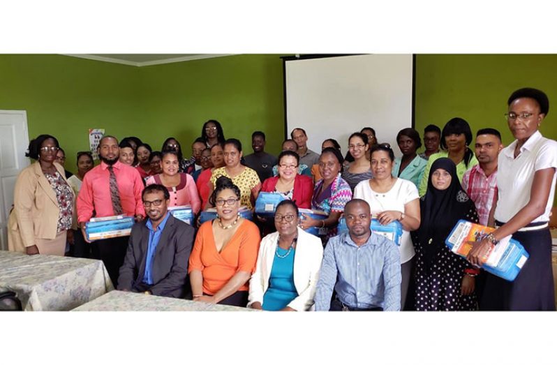 (Seated from left) President of R3CCI Halim Khan; Co-Founder of STEM Guyana, Karen Abrams; Regional Education Officer, Anesta Douglas, and General Secretary of R3CCI, Dennis Mayers, flanked by school teachers and representatives who received STEM robotic kits