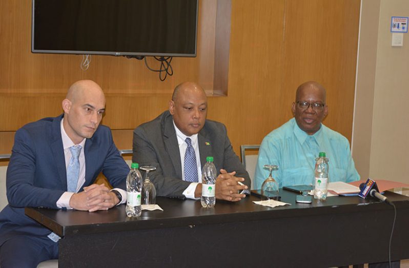 Finance Minister Winston Jordan (right) speaks at Thursday’s workshop wrap-up in the presence of Dr Daniel Wilde of the Commonwealth Secretariat (left) and Natural Resources Minister, Mr Raphael Trotman (Photo by Rabindra Rooplall)