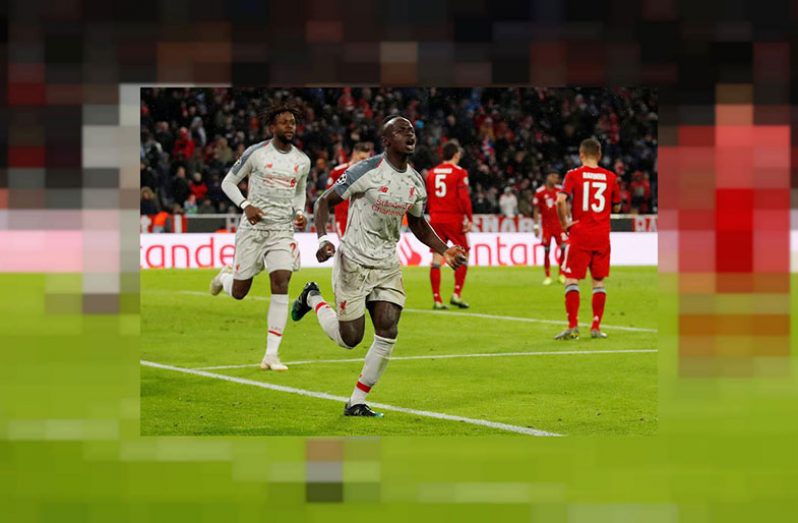 Liverpool's Sadio Mane celebrates scoring their third goal with Divock Origi. (Action Images via Reuters/Andrew Boyers)