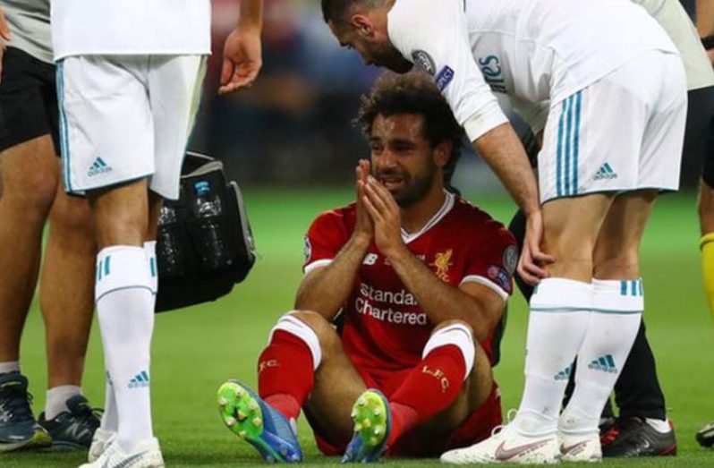 Mohamed Salah sits in pain after a shoulder injury in the UCL 2018 finals against Real Madrid