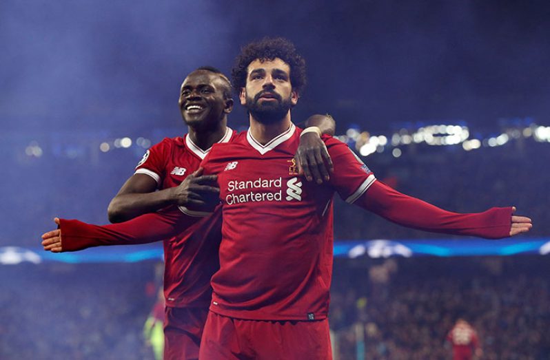 Liverpool's Mohamed Salah celebrates scoring their first goal with Sadio Mane. (REUTERS/Andrew Yates)