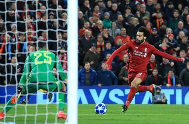 Liverpool's Mohamed Salah scores their first goal. (REUTERS/Jon Super)