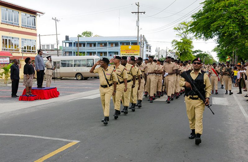 Minister Khemraj Ramjattan receiving the salute during the route march in front of the Ministry of Public Security (Delano Williams Photo)