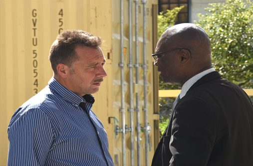 UK expert, Dr Sam Sittlington (left) in discussion with Head of SOCU, Sydney James. [Adrian Narine photo]