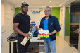 All-rounder Quentin Sampson (left) and Safraz Sheriffudeen, the CEO of VNet Technologies Inc.