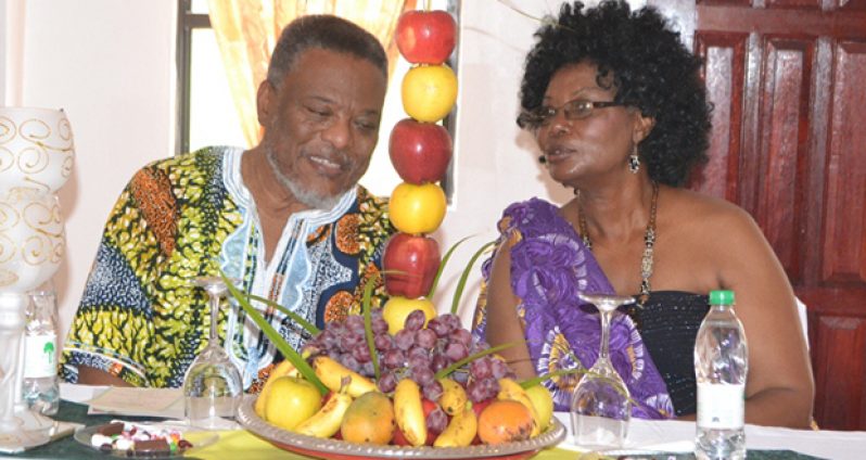 Prime Minister Samuel Hinds and proprietress  of J&C Renaissance Banquet Hall, Mrs. Janice Mc Almont, share a light moment during the opening of the facility