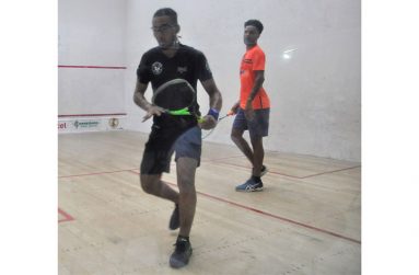 Samuel (left) and his cousin, Daniel, played each other at the senior national squash championships recently. (Sean Severs photo)