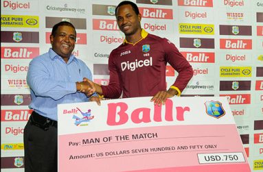 Marlon Samuels collects Man of the match award. (WICB photo)