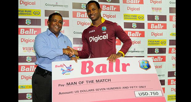 Marlon Samuels collects Man of the match award. (WICB photo)