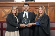 General Secretary (GS) of the Sanatan Dharma Maha Sabha (SDMS), Sabita Lalu (left) and member of the SDMS, attorney-at-law, Ms. Geeta Chandan-Edmond (at right), with SDMS member, Rodley Meren Mathoo (centre) who had received an award for recently being admitted to the bar (Delano Williams photo)