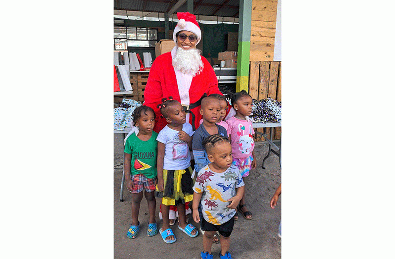 Some of the children at Leopold and Breeder Streets, Charlestown Christmas party with Santa Claus