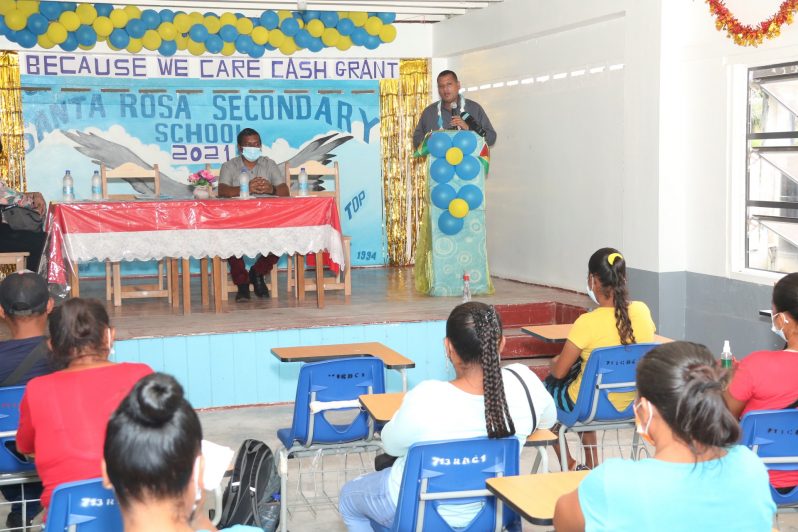 Housing and Water Minister, Collin Croal, addressing parents of the Santa Rosa Secondary School