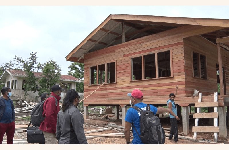 Minister of Local Government and Regional Development, Nigel Dharamlall and his team along with Toshao of Kokerite, Sherman Adams inspect the work done so far on the primary school (DPI photo)