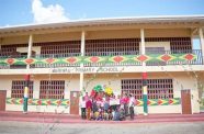 Minister of Education, Priya Manickchand; Minister within the Ministry of Housing and Water, Susan Rodrigues; Deputy Chief Education Officer (Amerindian and Hinterland Education Development), Marti De Souza; Senior Councillor of Meriwau, Joan Stephen; residents and pupils of Meriwau