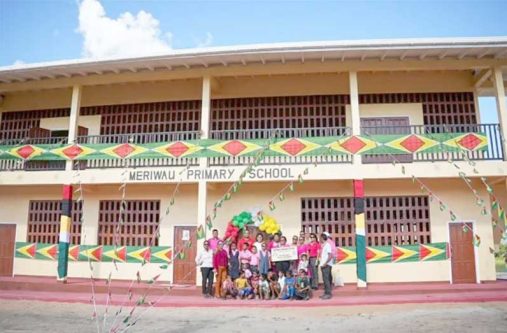 Minister of Education, Priya Manickchand; Minister within the Ministry of Housing and Water, Susan Rodrigues; Deputy Chief Education Officer (Amerindian and Hinterland Education Development), Marti De Souza; Senior Councillor of Meriwau, Joan Stephen; residents and pupils of Meriwau