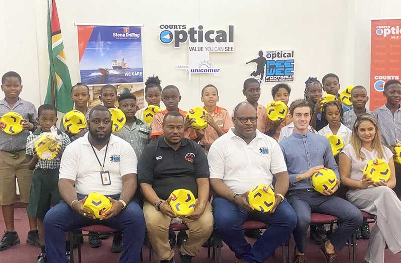 Officials of Courts Optical, Stena Drilling Guyana and Petra Organisation pose with schools’ representatives at the team briefing