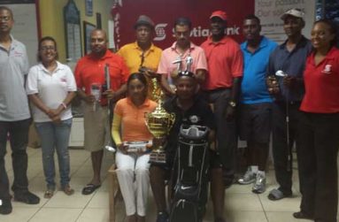 Overall winner Imran Khan (sitting right) displays his spoils after claiming the Scotiabank-sponsored tournament last Saturday. On his right is Joaan Deo, while Natasha Hamilton stands at right and Jennifer Cipriani is second from left.