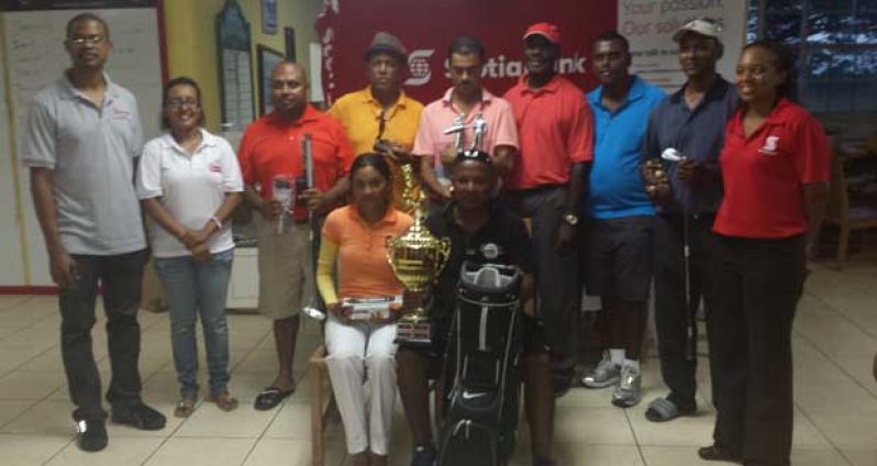 Overall winner Imran Khan (sitting right) displays his spoils after claiming the Scotiabank-sponsored tournament last Saturday. On his right is Joaan Deo, while Natasha Hamilton stands at right and Jennifer Cipriani is second from left.