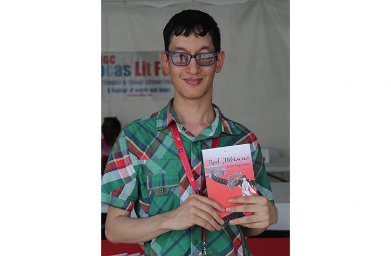 Scott Ting A Kee and his book 'Red Hibiscus' at the Bocas Lit Fest at CARIFESTA XIV