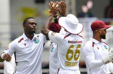 Jayden Seales (left) celebrates one of his five wickets against Australia on the opening day of the first Test at Kensington Oval (Getty Images)