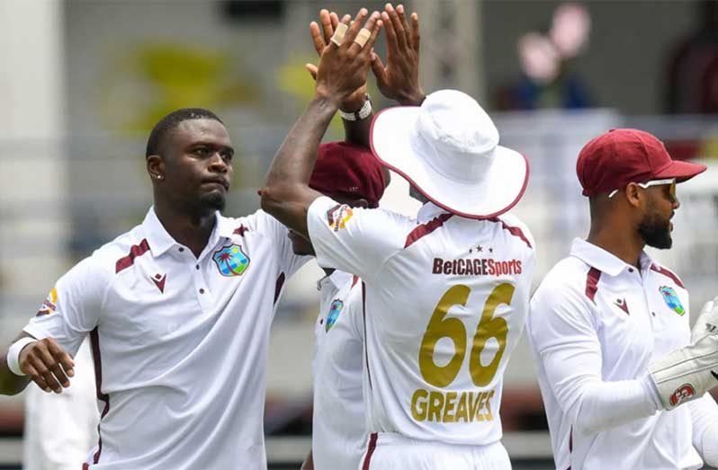 Jayden Seales (left) celebrates one of his five wickets against Australia on the opening day of the first Test at Kensington Oval (Getty Images)