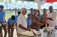 From left: Basdeo Seenauth, Ramona Dyal and Vemen Walter in the presence of students.