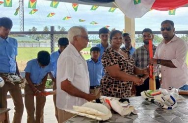 From left: Basdeo Seenauth, Ramona Dyal and Vemen Walter in the presence of students.