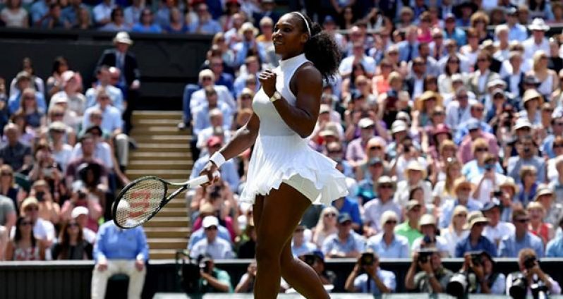 Serena Williams celebrates winning her match against Russia's Elena Vesnina at the All England Lawn Tennis & Croquet Club, Wimbledon, England yesterday. (REUTERS/Toby Melville)