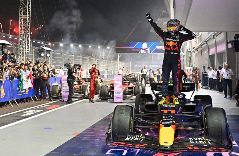 Singapore - October 2, 2022: Red Bull's Sergio Perez celebrates after winning the Singapore Grand Prix (REUTERS/Caroline Chia)