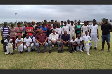 Seated from left: BCB president Hilbert Foster, Sir Andy Roberts and Roland Butcher with youngsters and other at one of the sessions on Thursday