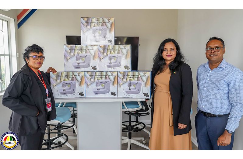 Minister of Human Services and Social Security Dr Vindhya Persaud (centre), along with WIIN coordinator Sanjay Pooran receives over 100 sewing machines from Silvie’s Industrial Solutions’ Quality Management System Manager, Deepawattie Persaud