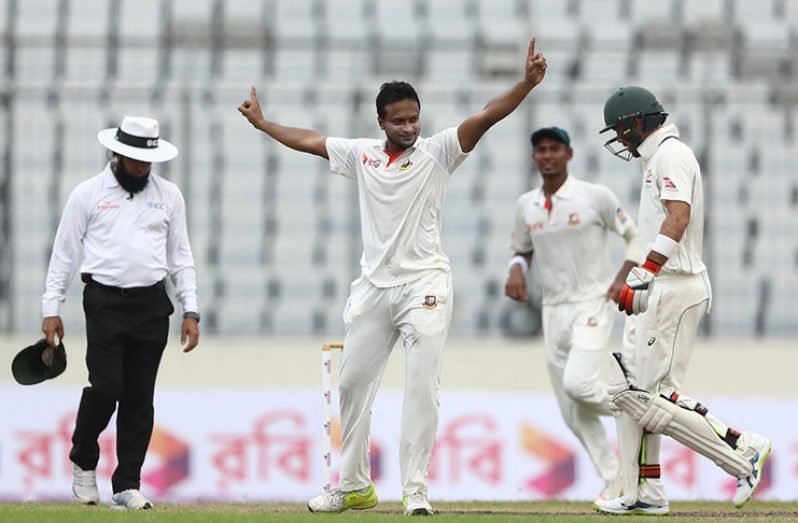 Shakib Al Hassan cleans Pat  Cummins up in the second over after tea before taking out Josh Hazlewood to complete a five-wicket haul and ensure a 43-run lead for his team. (Getty Images)