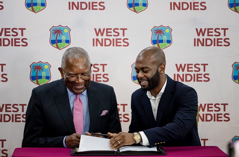 Dr. Kishore Shallow (right) and the Co-Founder and Chairman of the CAGE Companies Robert B. Washington signing  the agreement