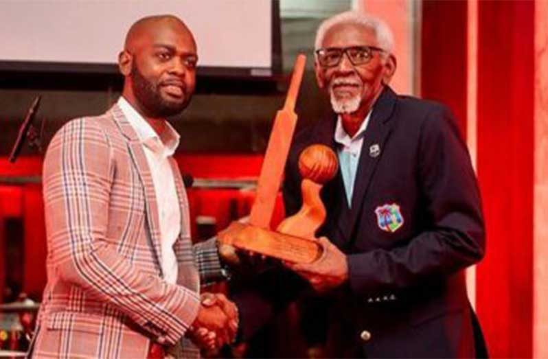 CWI president Dr Kishore Shallow presenting Conde Riley with an award in 2024