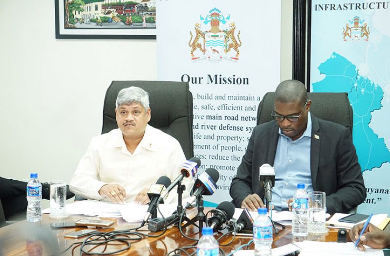 Minister of Public Infrastructure, David Patterson, sits next to Minister within
the Ministry of Public Infrastructure, Jaipaul Sharma, as the latter addresses
the media (Carl Croker photo)