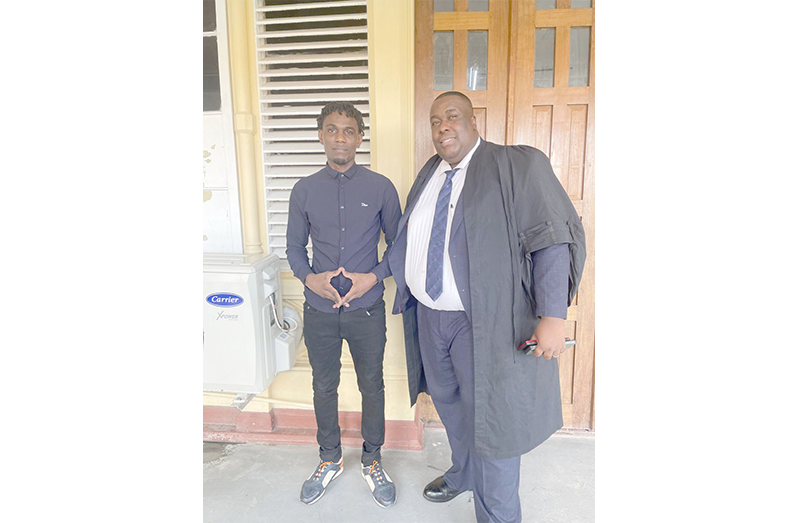 Shawn George (left) and his attorney, Glendon Greenidge, were pictured at the High Court on Thursday