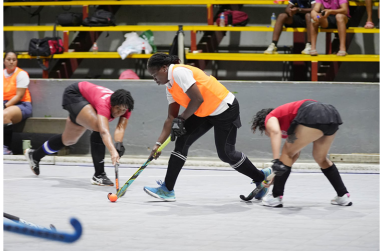 Over-40 striker, Shebiki Baptiste, carves her way through the Old Fort defense.