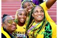 Minister of Culture, Gender, Entertainment and Sport, Olivia Grange (left) and ‘Team Jamaica’ supporters, share a moment with Shelly-Ann Fraser-Pryce (second left), following her victory in the women’s 100-metre event at the 2022 World Athletics Championships in Eugene, Oregon