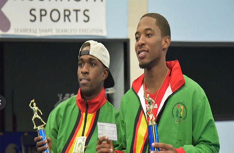 Guyana National table tennis teammates Shemar Britton (Westchester 2350 Open champion) and Nigel Bryan (bronze medallist) pose after receiving their spoils.