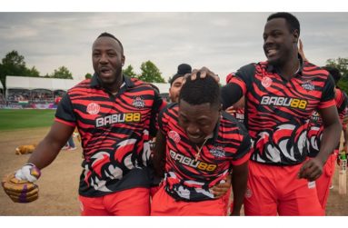 Andre Russell, Sherfane Rutherford and Carlos Brathwaite celebrating the win for the Montreal Tigers.