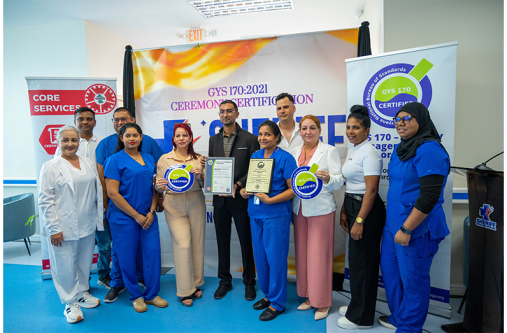 The team at the Sheriff General Hospital Inc., with Laboratory Quality Manager, Azam Latiff (centre), at Thursday’s brief certification ceremony
