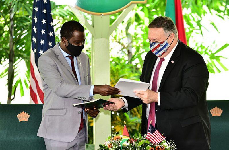 Foreign Affairs Minister, Hugh Todd, and US Secretary of State, Michael Pompeo, on Friday, exchanged signed copies of the Shiprider Agreement at the Baridi Benab at State House (Adrian Narine photo)