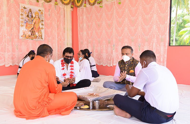 Attorney-General and Minister of Legal Affairs, Anil Nandlall S.C. and Indian High Commissioner Dr. K. J. Srinivasa participating in a havan at the Cove and John Ashram, on the East Coast of Demerara (Delano Williams photo)