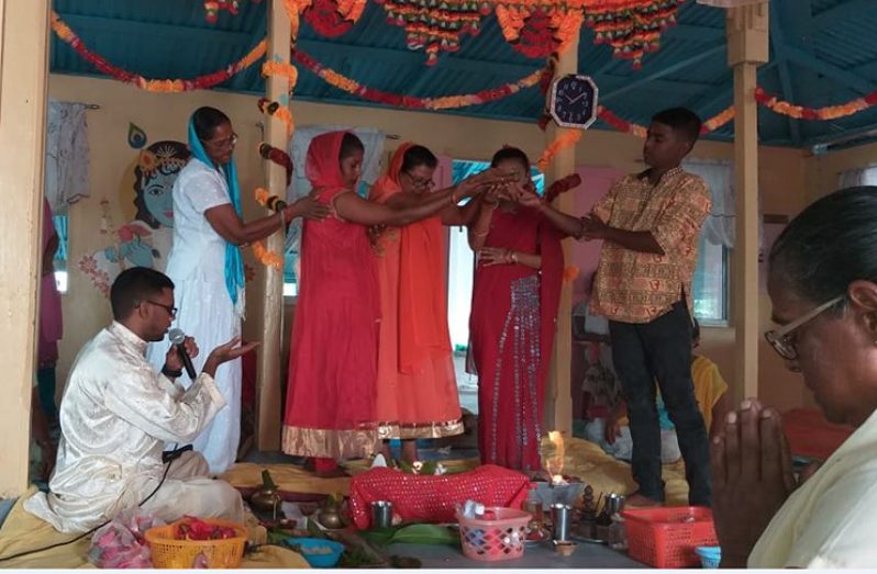 Persons from the Golden Fleece Vishwa Jhotir Mandir performing Shivratri puja