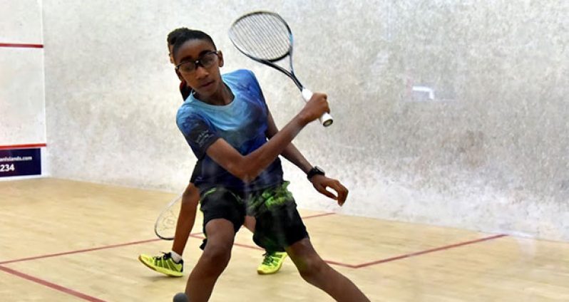 Defending Boys’ Under-13 champion Shomari Wiltshire in his semifinals match against Bermuda’s Matthew Elliott