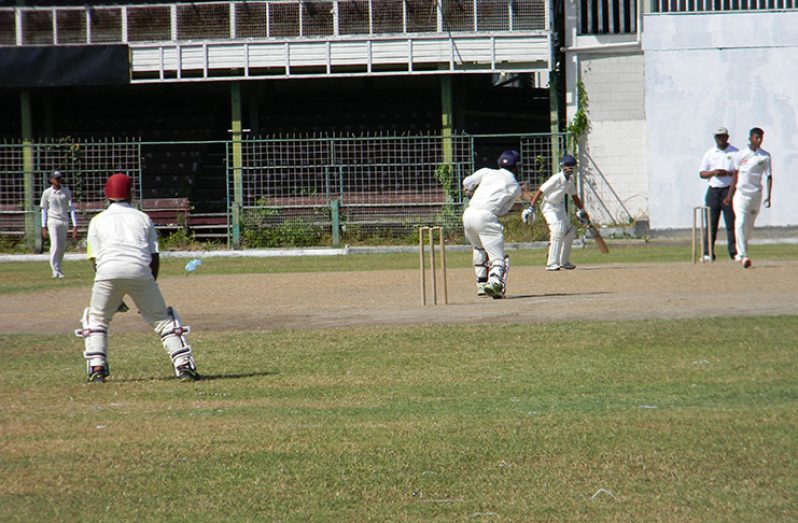 Alphius Bookie (Christ Church) plays a cover drive off pacer Mark Ramsammy (School of the Nations).