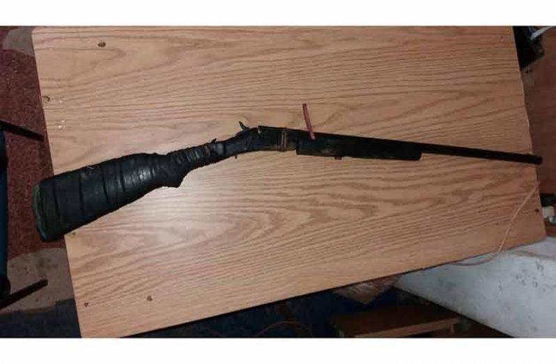 The 12-gauge shotgun that was found in the bushes not too far from the body.