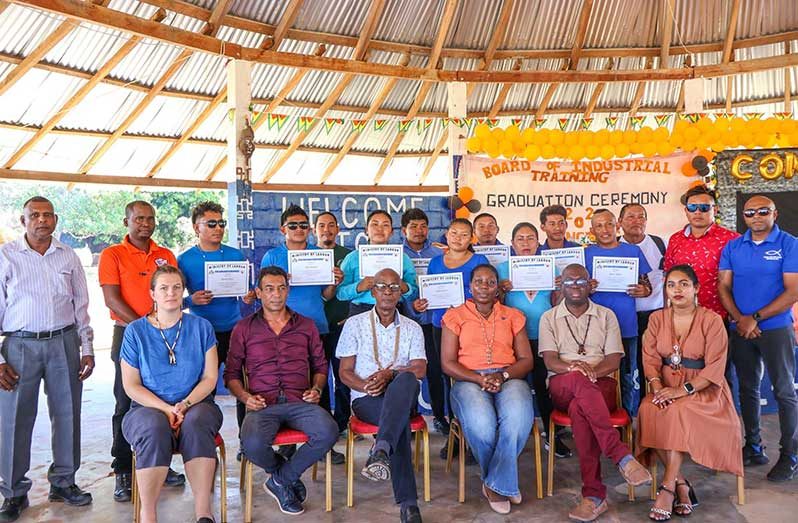 Twenty residents of Shulinab Village in Region Nine are now certified Small Engine Technicians and Welder Fabricators. In this BIT photo, several of the graduates pose with Minister of Labour, Joseph Hamilton (seated, centre); CEO of Food for the Poor- Guyana Inc., Andrea Benjamin; CEO of BIT Richard Maughn, IOM Regional Labour Mobility and Social Inclusion Coordinator Maria-Alexandra Bassermann and other officials following the graduation ceremony