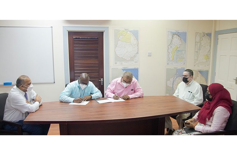 Health Minister, Dr Frank Anthony (left) looks on at the signing of the agreement by officials of the Central Islamic Organisation of Guyana and the Ministry of Health (CIOG photograph)